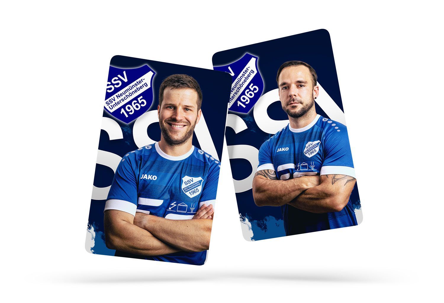 Two men in blue jerseys are standing next to each other with their arms crossed.
