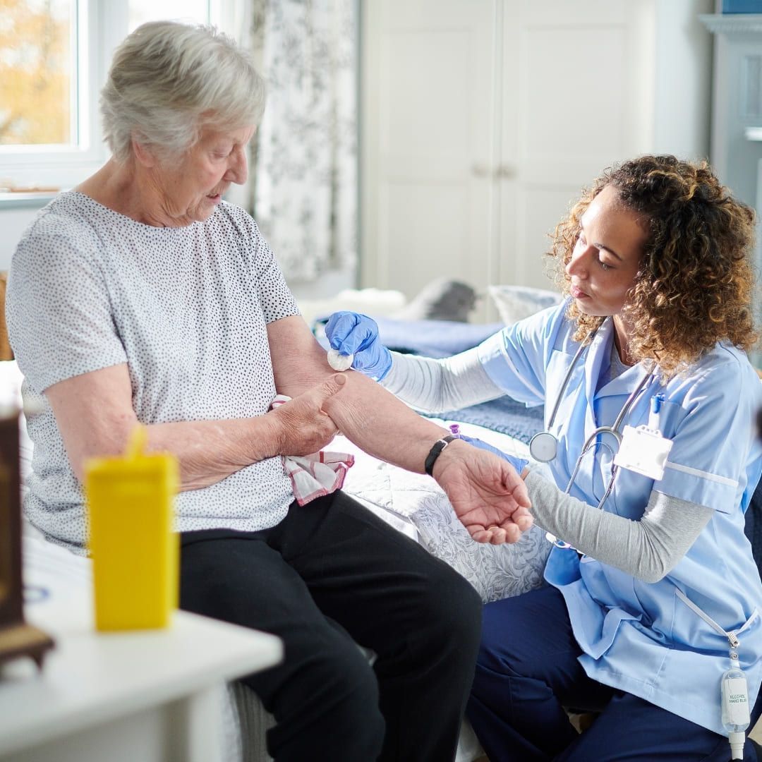 An older woman receiving diabetic care at a doctor's appointment.