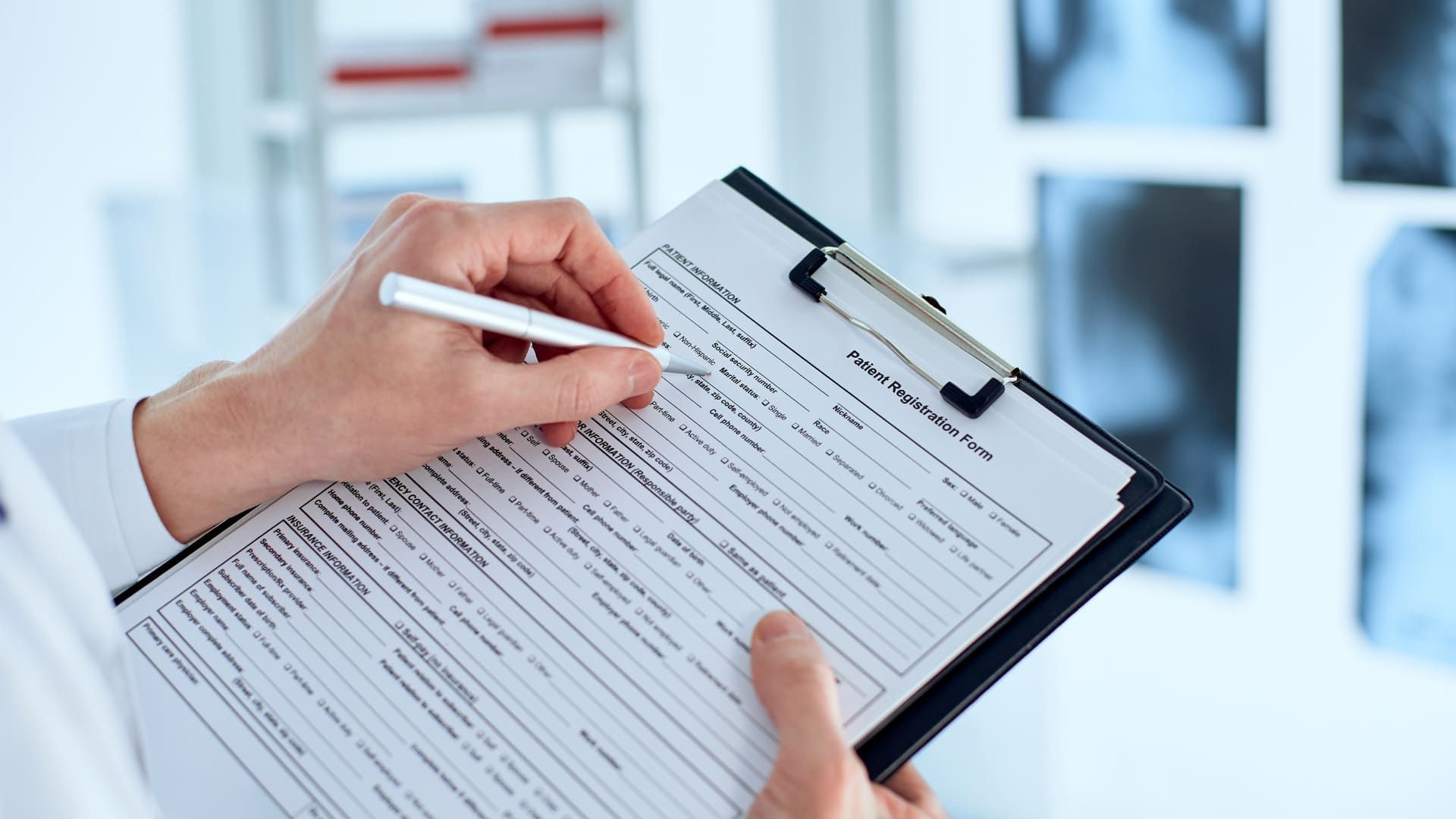 A patient filling out a medical history form.
