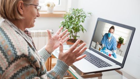 An older woman taking a telemedicine appointment.