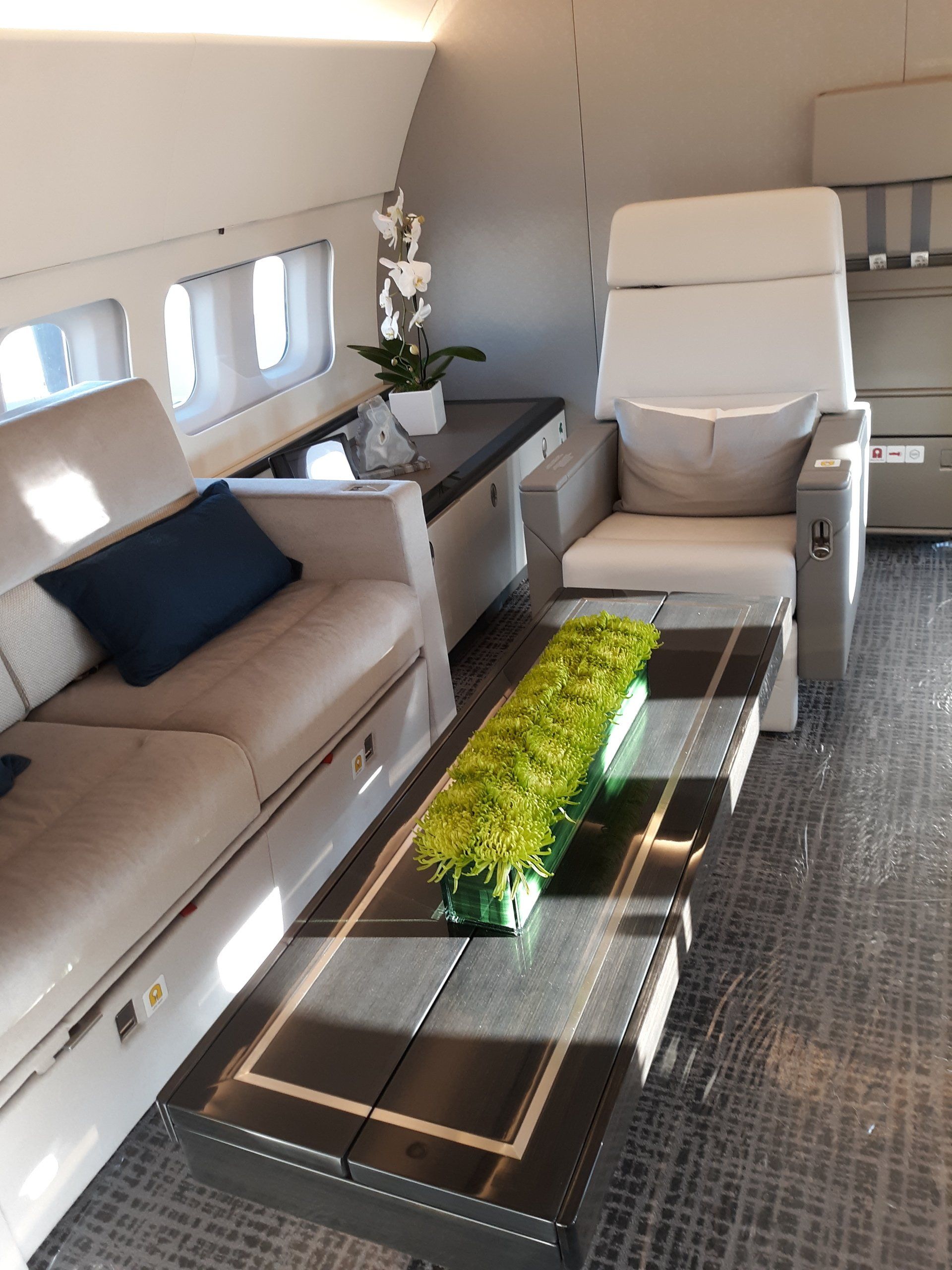 A living room with a couch a chair and a coffee table