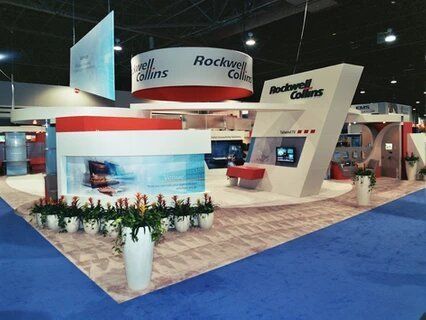 A rockwell collins exhibit with a blue carpet