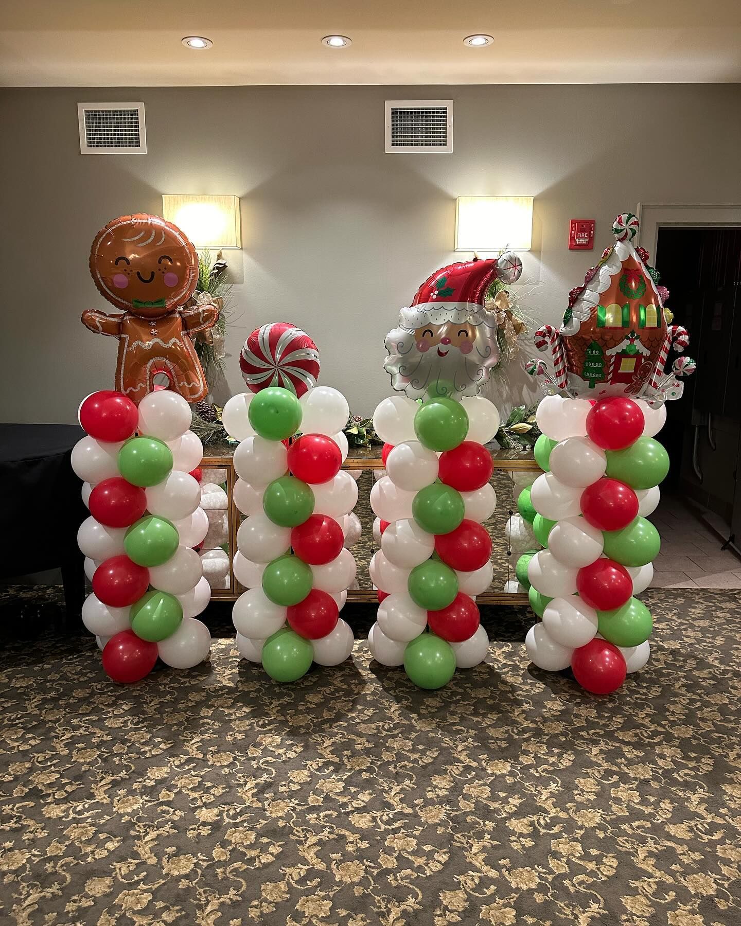 A room filled with balloons and decorations for christmas.