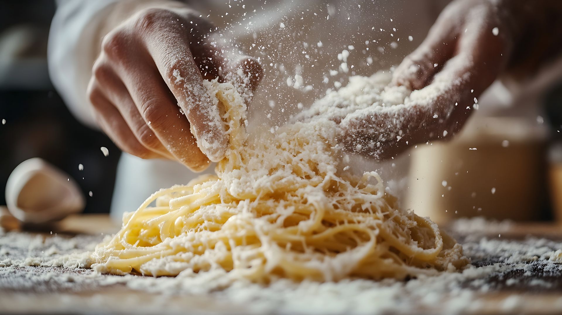 Chef’s hands dusting flour on fresh pasta, a masterpiece of authentic handmade Italian food.