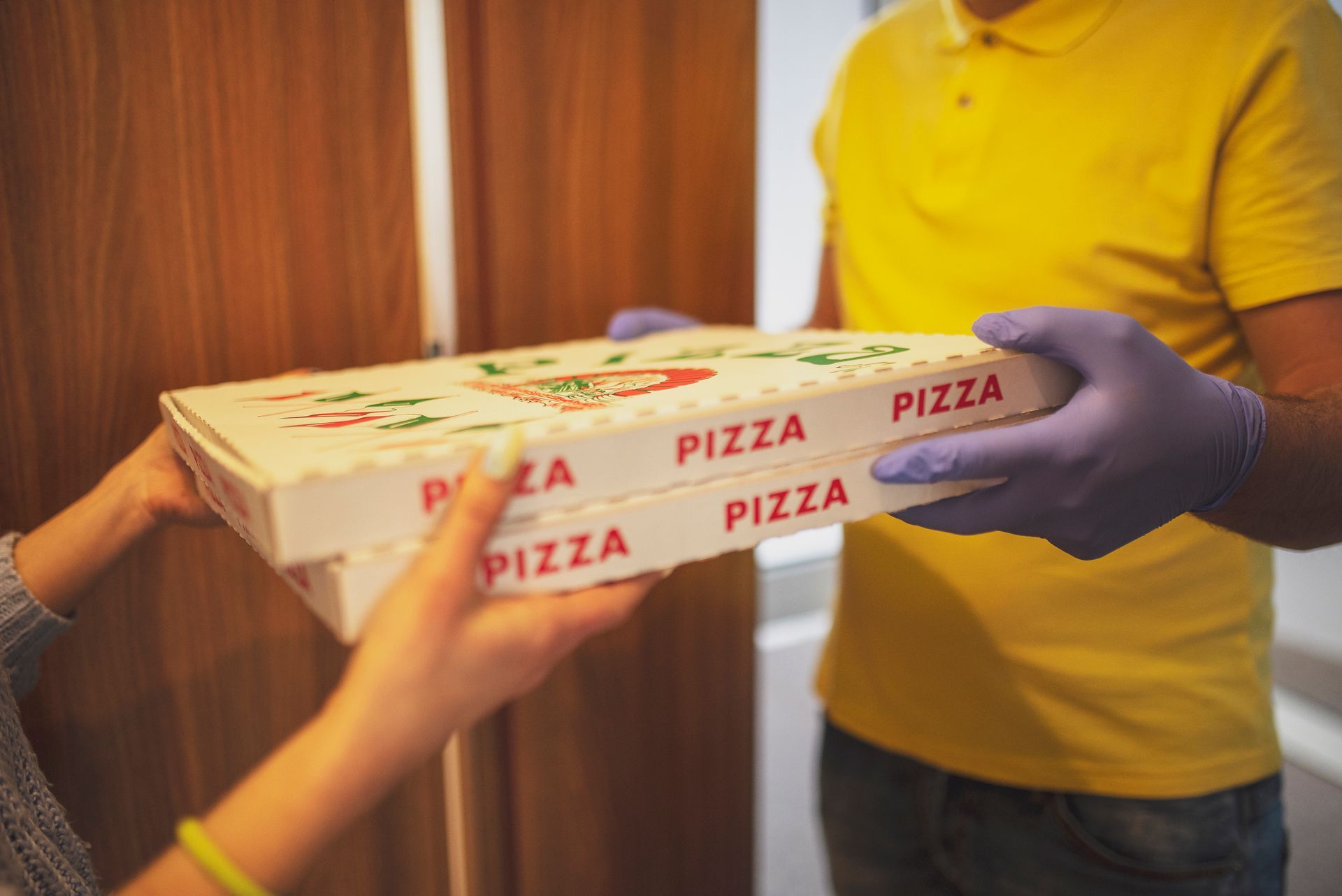 A man with safety gloves delivers pizza | Pizza Delivery | Chicago, IL