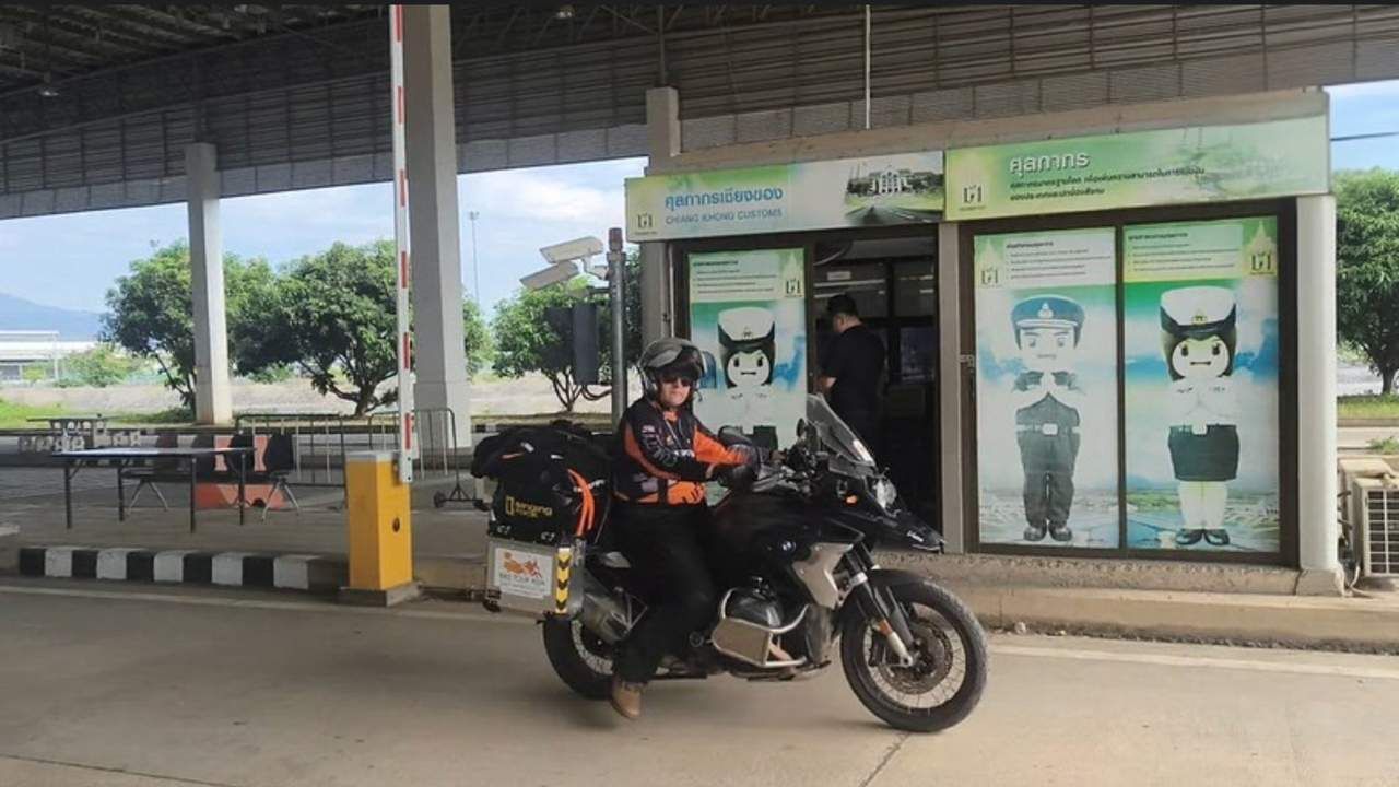 Bike tour asia -rider at the immigration