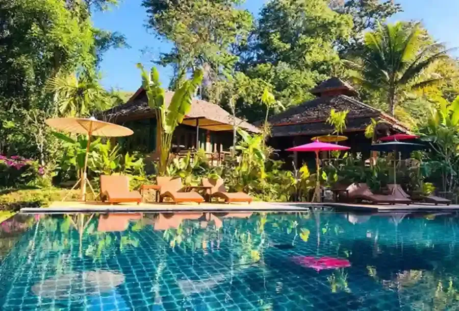Luxury boutique resort with tropical pool surrounded by nature in Mae Hong Son Thailand
