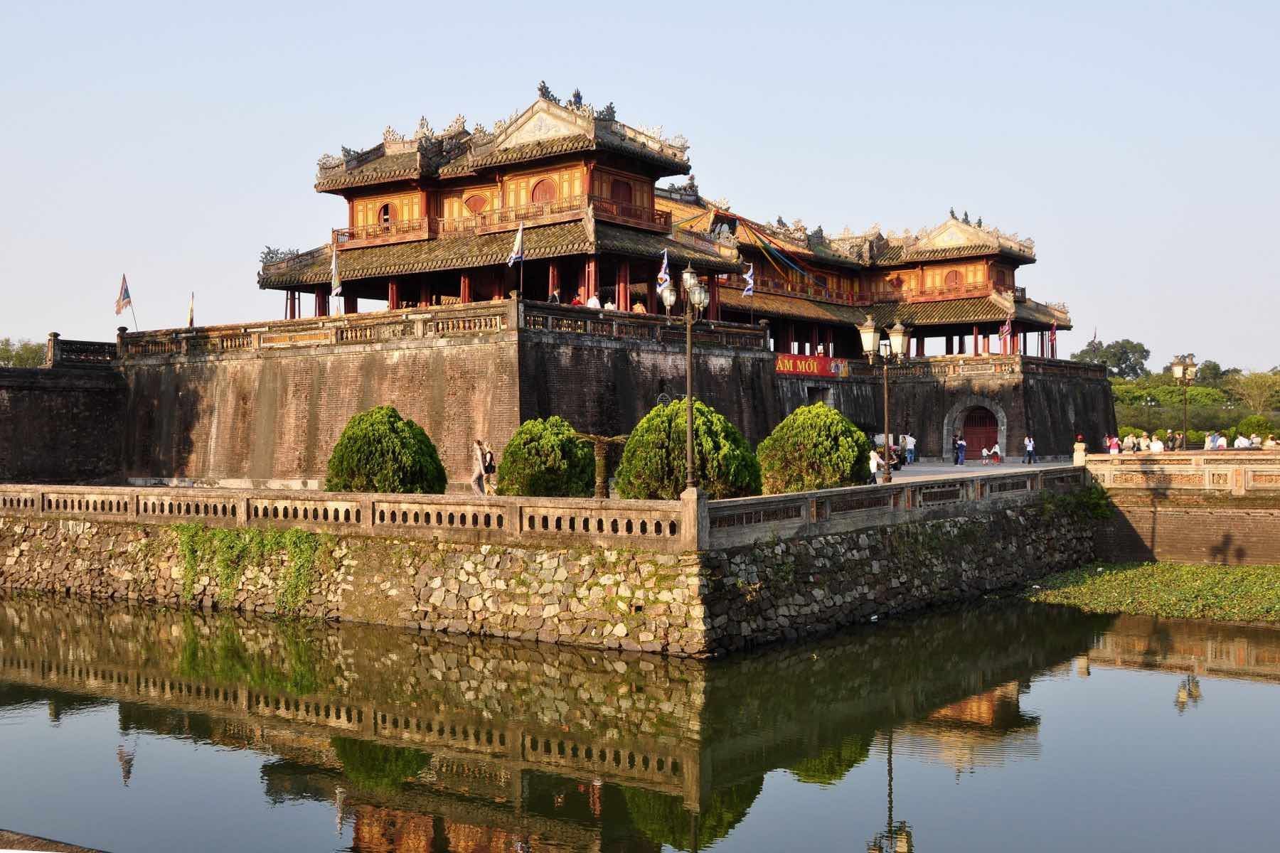 The historic Imperial Citadel of Hue reflecting in the moat, central Vietnam
