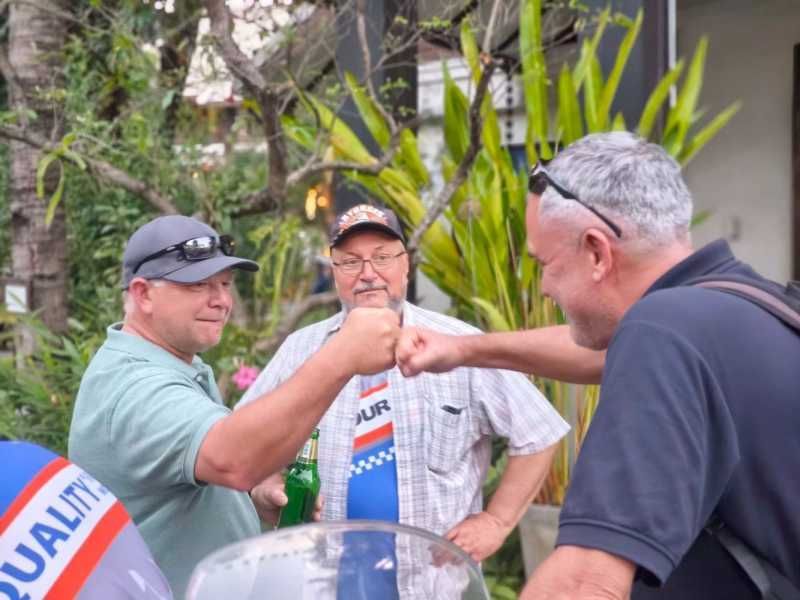 “Motorcycle tour riders sharing a relaxed moment during a guided tour in Northern Thailan