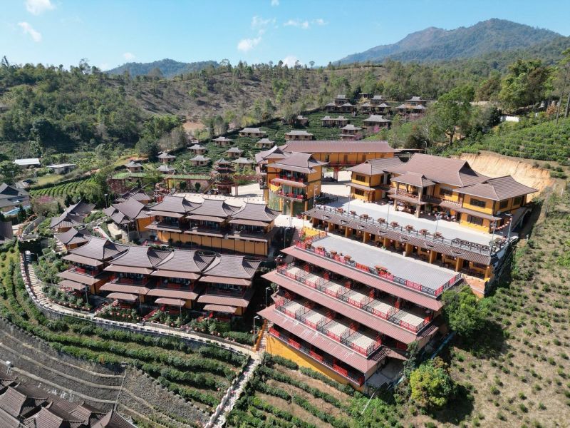 baan rak thai Aerial view of a mountain resort surrounded by hills in Northern Thailand