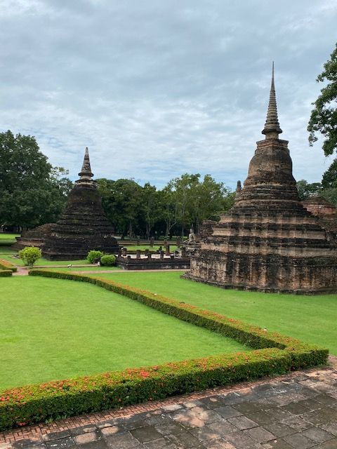 Ancient temples and pagodas at Sukhothai Historical Park, a UNESCO World Heritage site in Thailand
