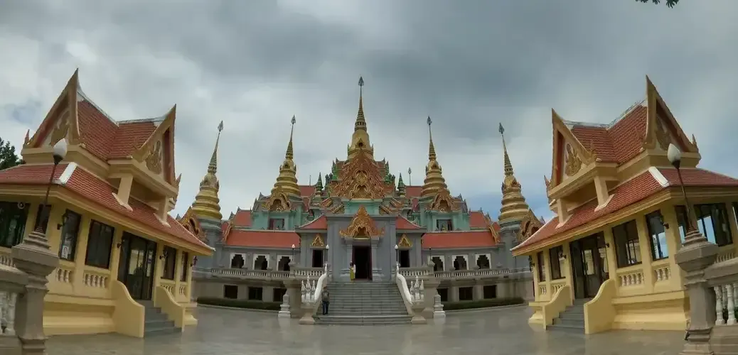 Beautiful Thai temple with ornate golden spires and red roofs at Thang Sai Temple in Prachuap Khiri Khan, Thailand