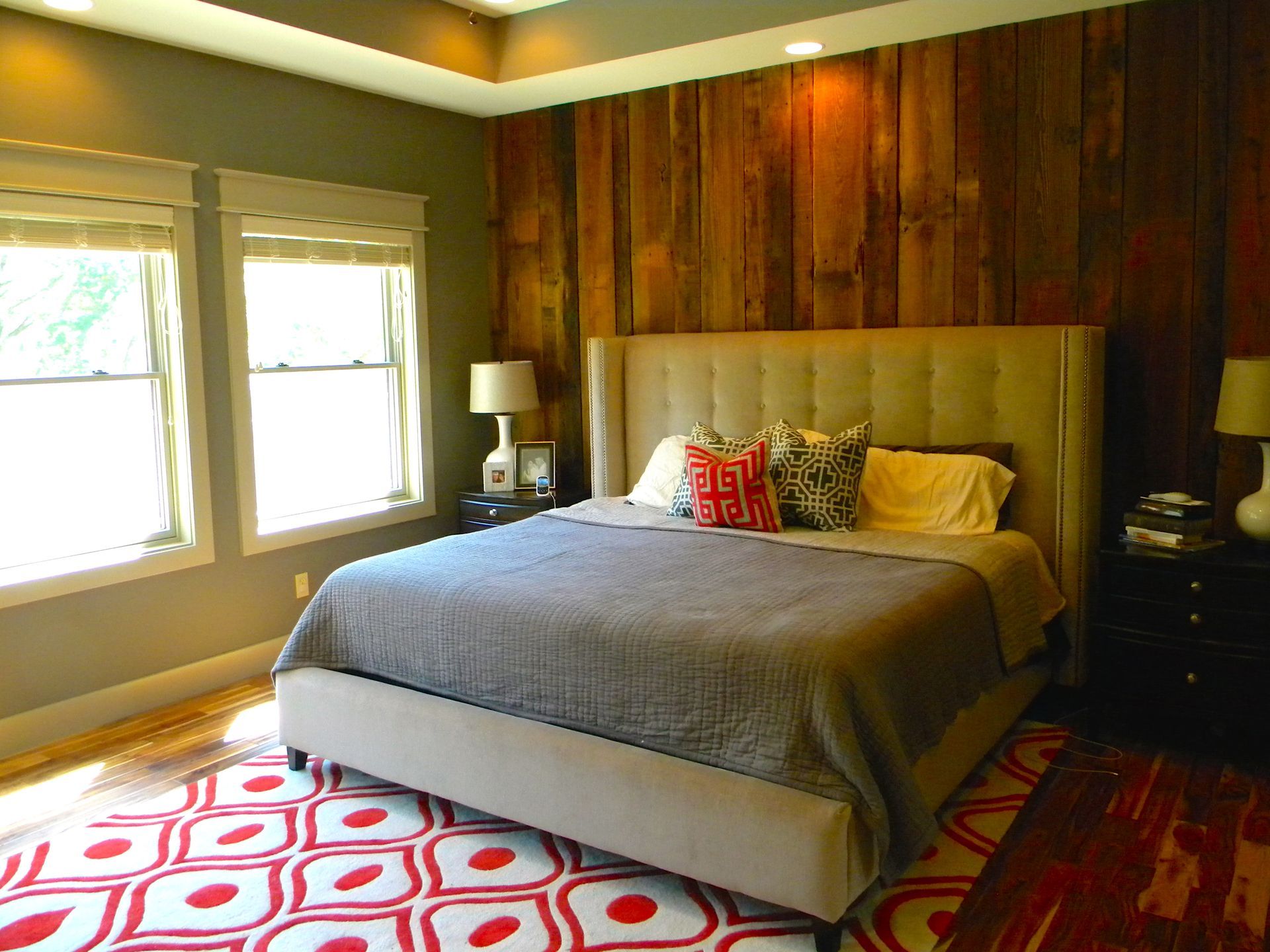 A Bedroom With Red & White Carpeting in a Mid-Missouri Home By Design Built Homes.