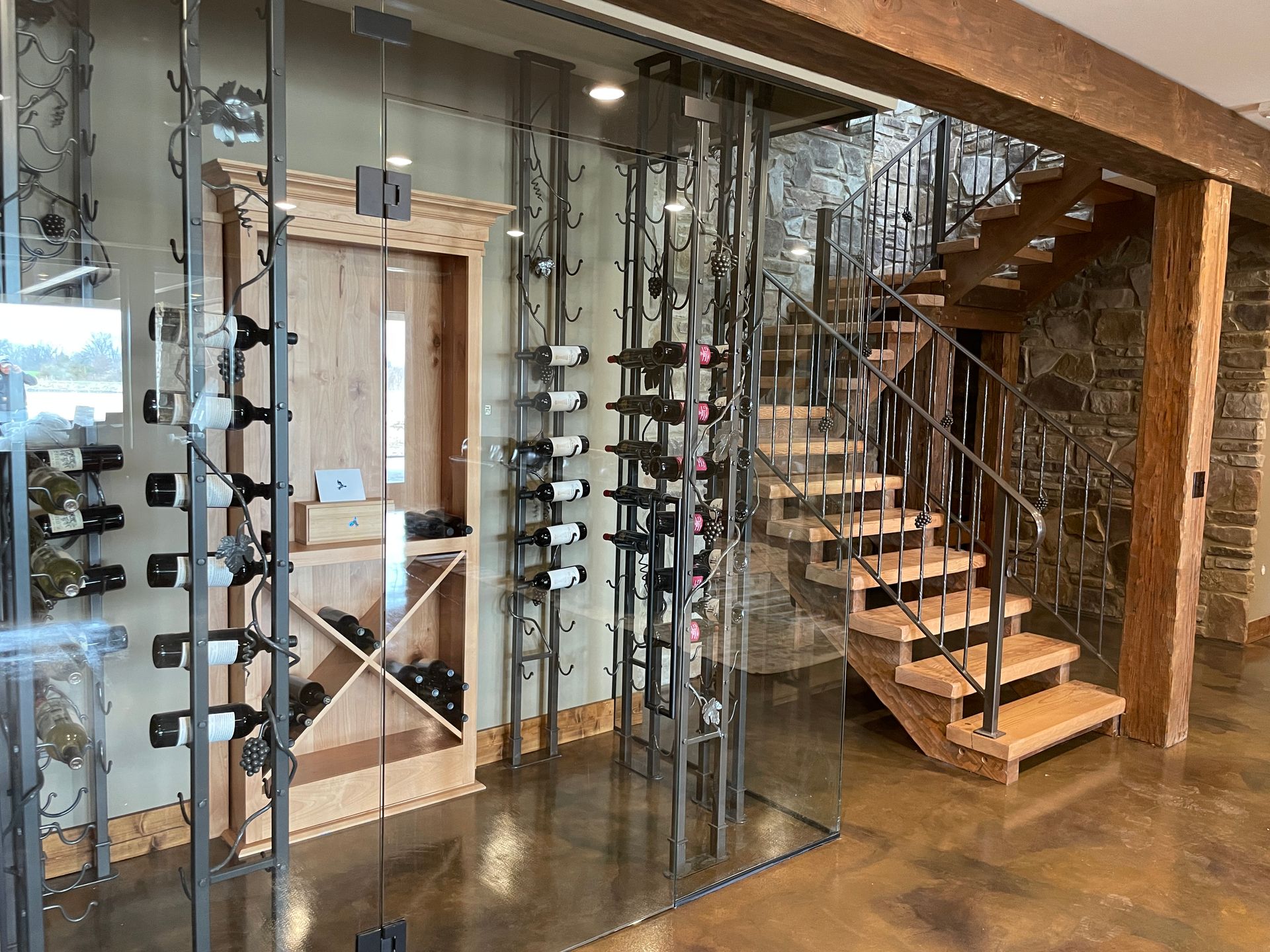 A Basement With a Wine Cellar in a Custom Mid-Missouri Home By Design Built Homes.