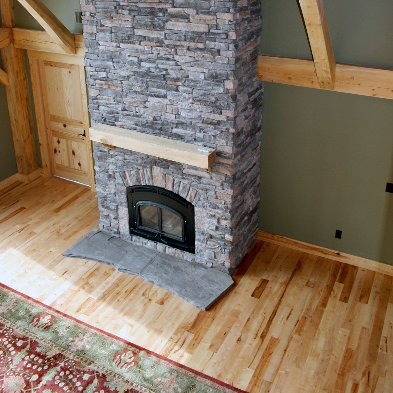 Complete Your Mid-Missouri Custom Home From Design Built Homes With a Cozy Fireplace.