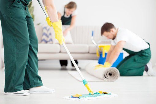 Man Cleaning the Carpet — Savannah, GA — Treat Your Feet Carpet Cleaners Inc