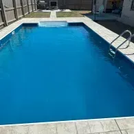 inground pool with steps and ladder