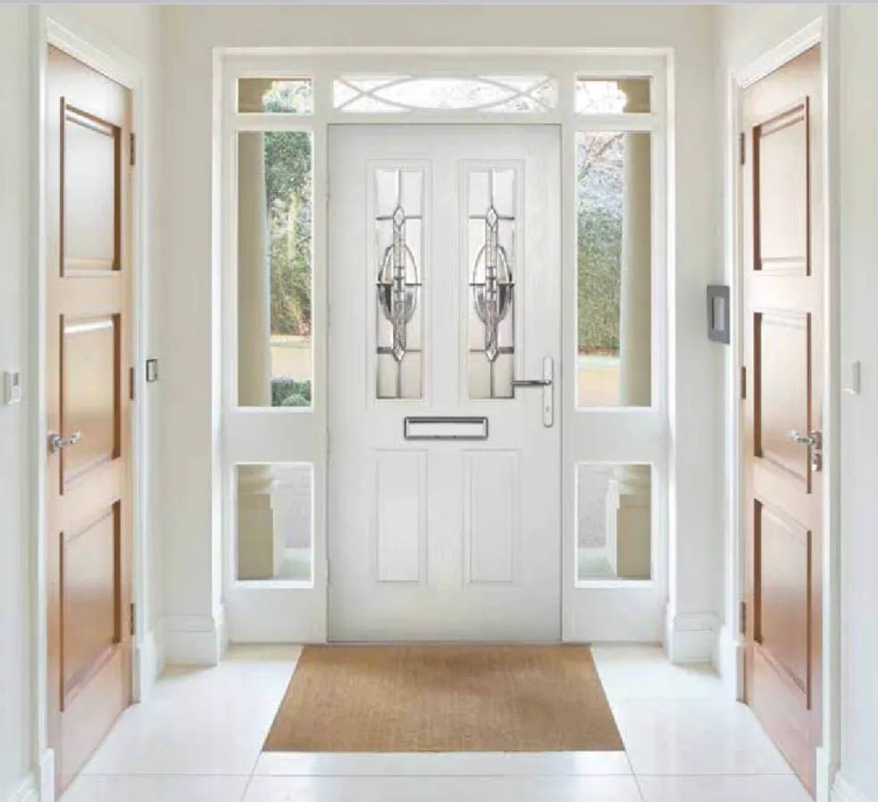 White front door with sidelights and stained glass, flanked by two wooden doors in a bright hallway.