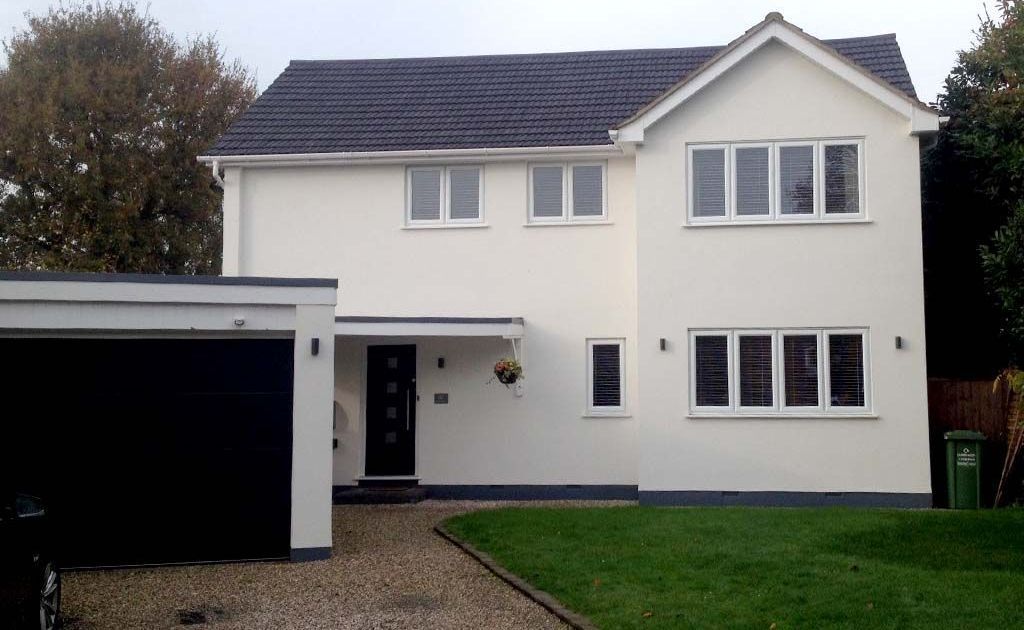 a white house with new windows and doors