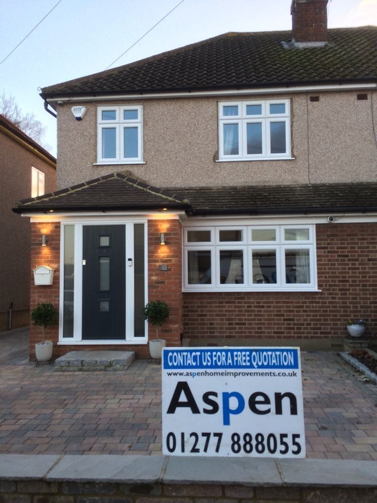 A house with a sign in front of it that says aspen