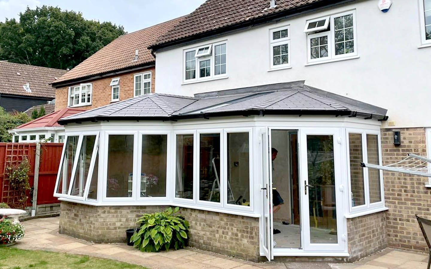 a conservatory with a warm roof by Aspen Home Improvements