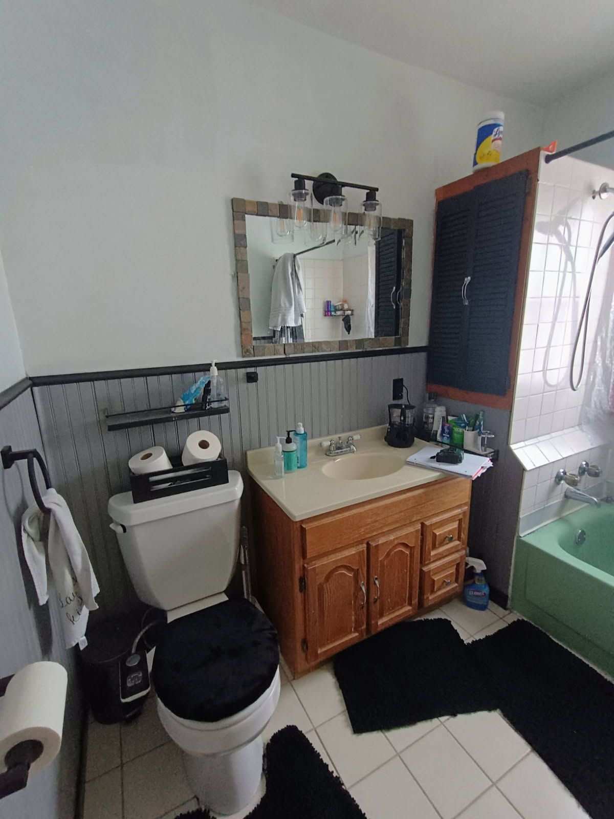 A bathroom with a toilet , sink and bathtub