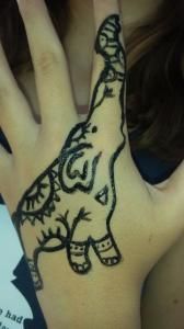 A person has a drawing of an elephant on their hand.