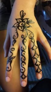 A close up of a person 's hand with a tattoo on it