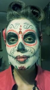 A woman with sugar skull makeup on her face