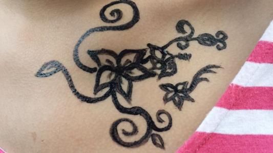 A close up of a tattoo on a person 's chest.