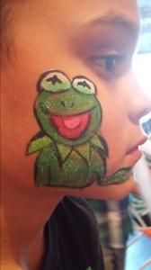 A person with a frog painted on their face.