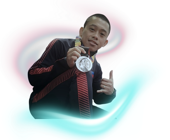 A person in a black and red athletic jacket smiles while holding a silver medal, flashing a shaka hand gesture.