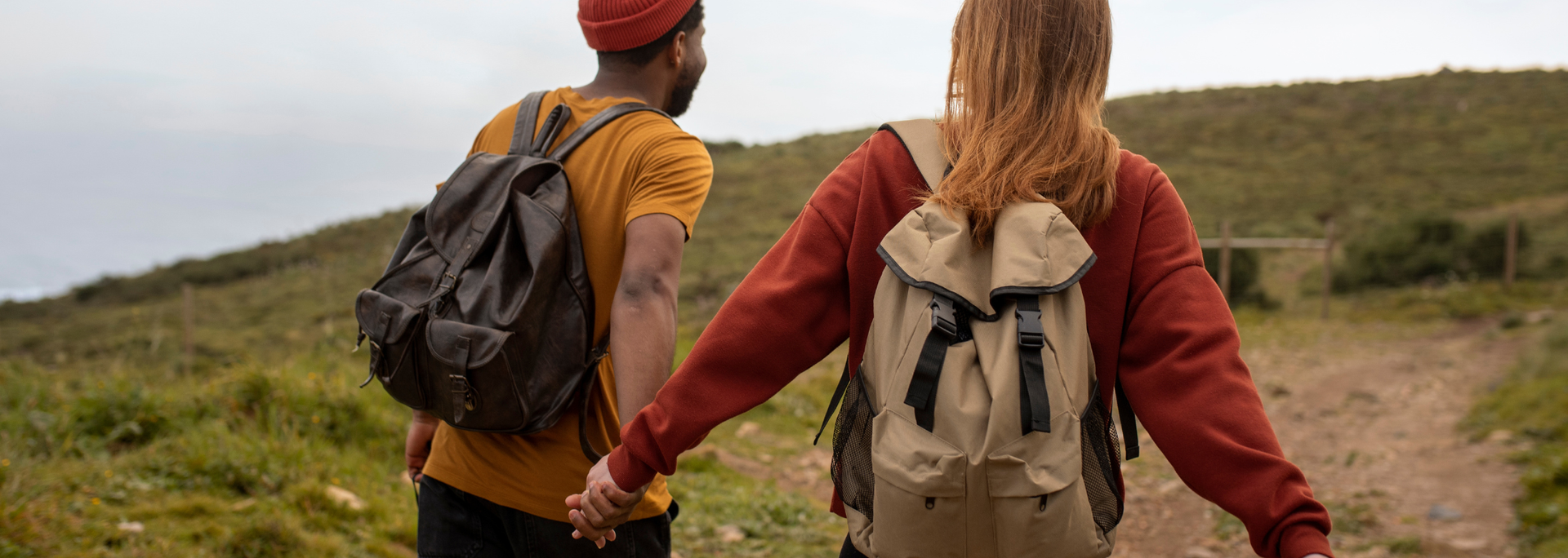 Picture of a couple walking with backpacks. 