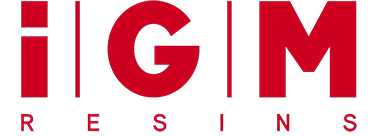 a red logo for igm resins on a white background