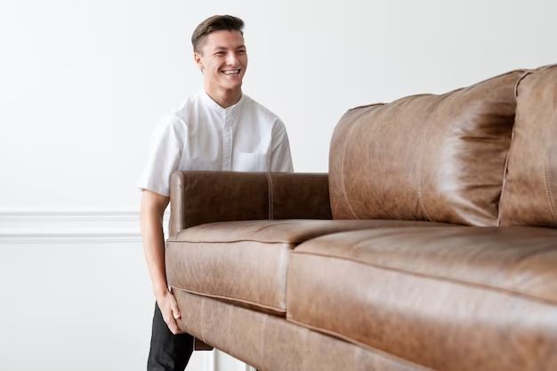 Man Carrying Sofa