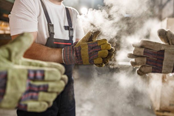 Men Removing Dust from Gloves