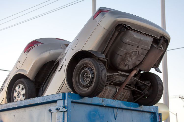 junk cars in dumpster