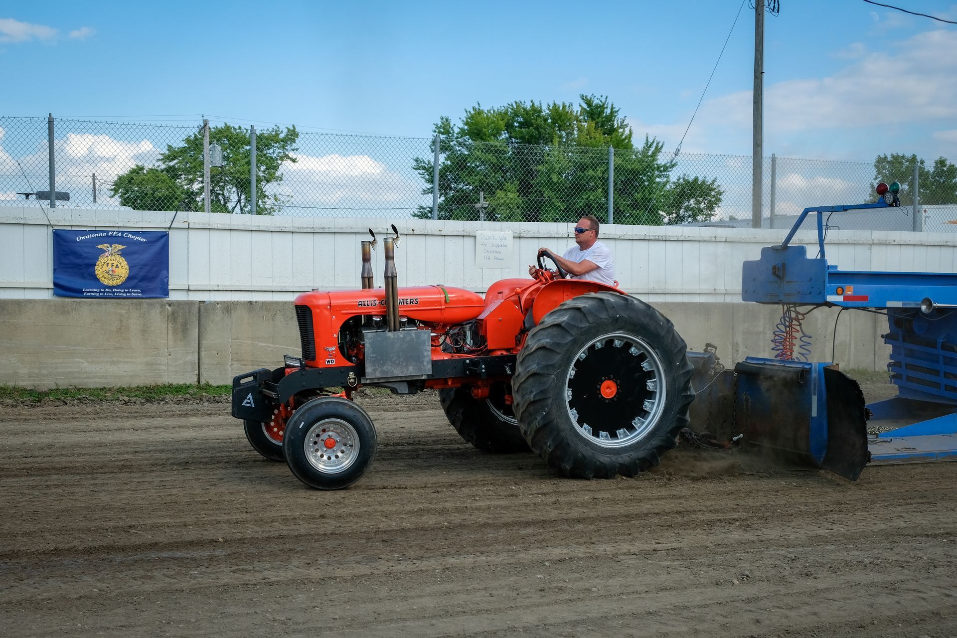 Hairball Band performing on stage with green lights and crowd.