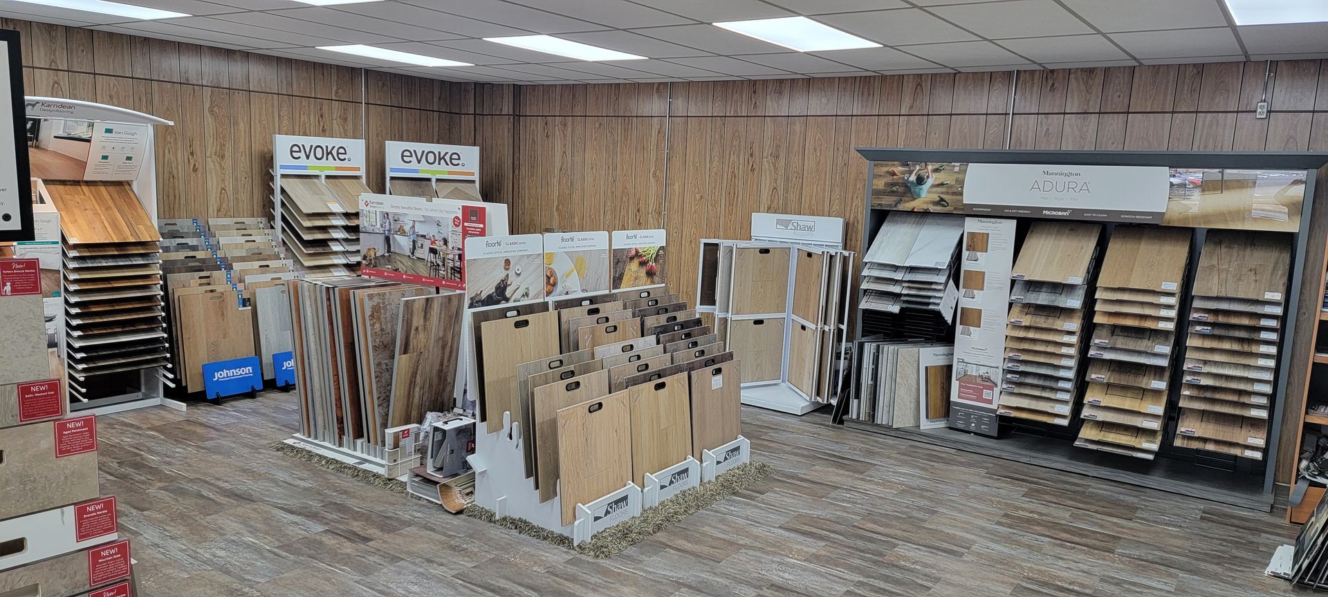 A flooring store interior with displays of wood flooring samples.