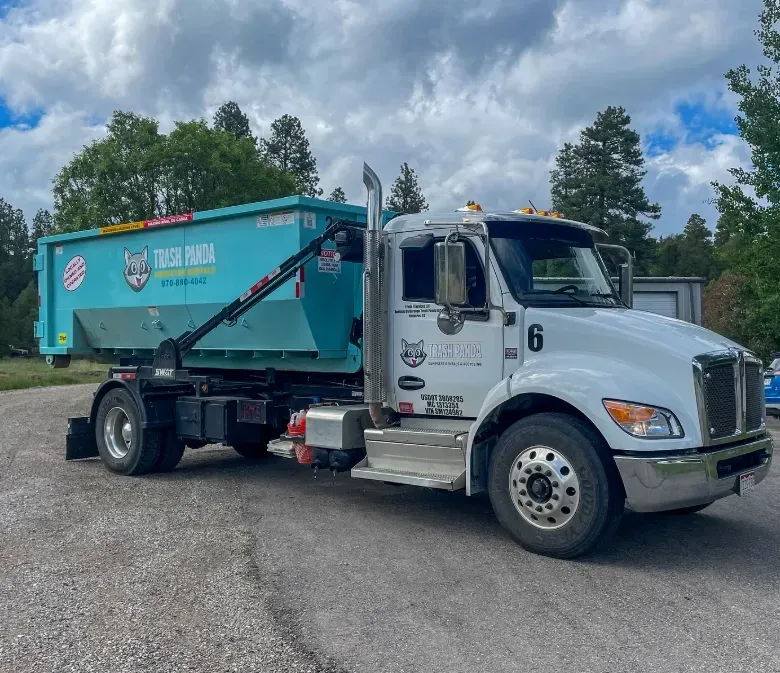 A dump truck is parked on the side of the road.