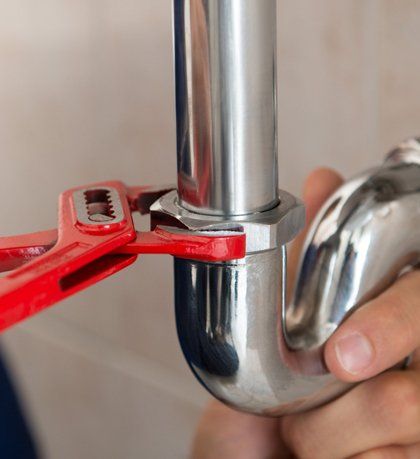 Plumbing Repair — Plumber Repairing A Pipe In Edmond, OK