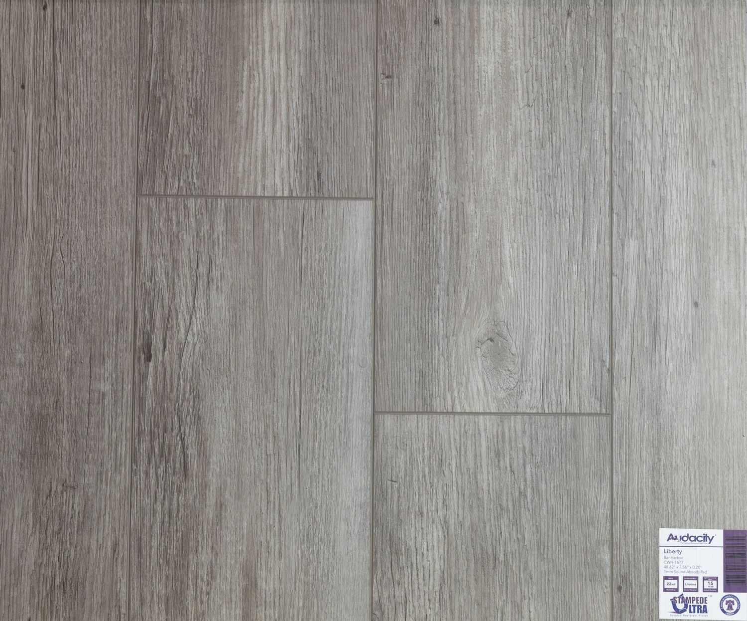 A close up of a wooden floor with a label on it.