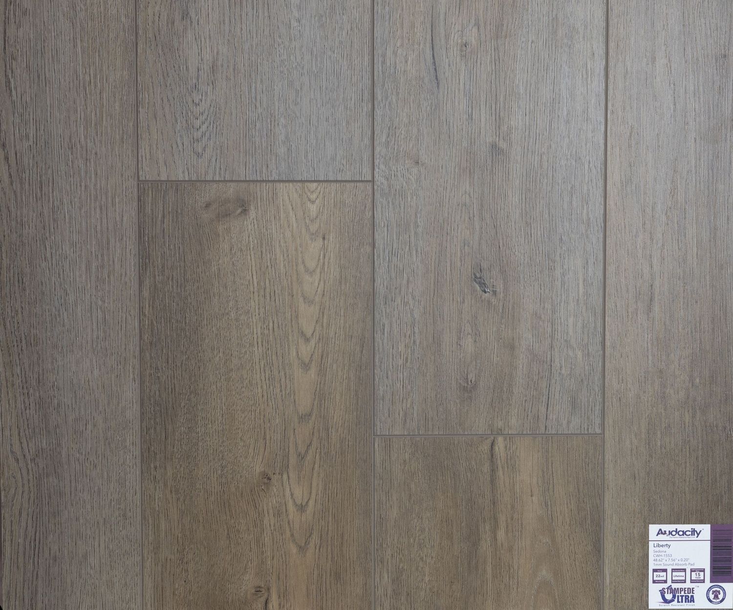 A close up of a wooden floor with a label on it.