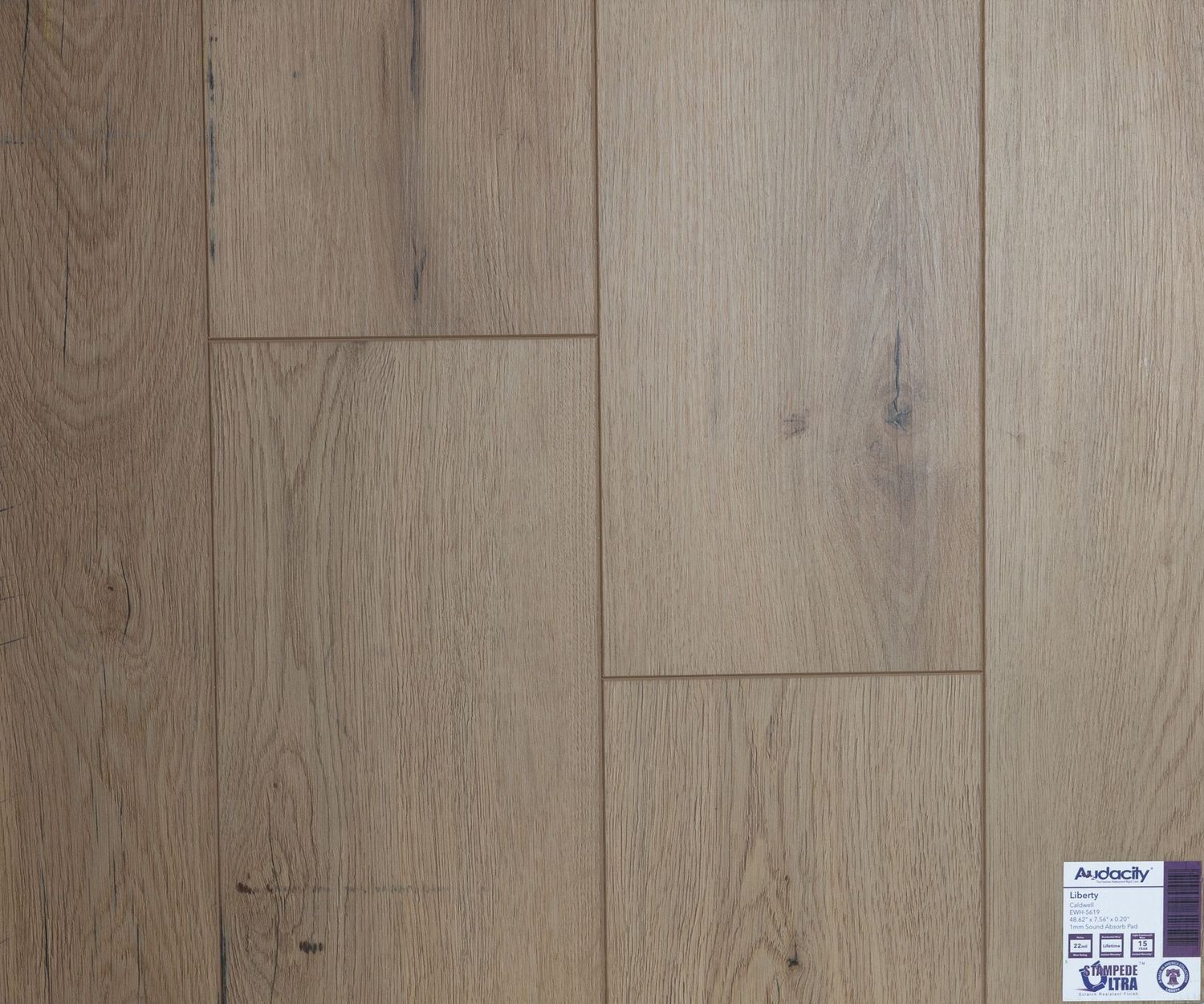 A close up of a wooden floor with a label on it.