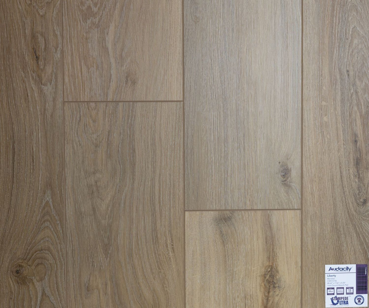 A close up of a wooden floor with a label on it.