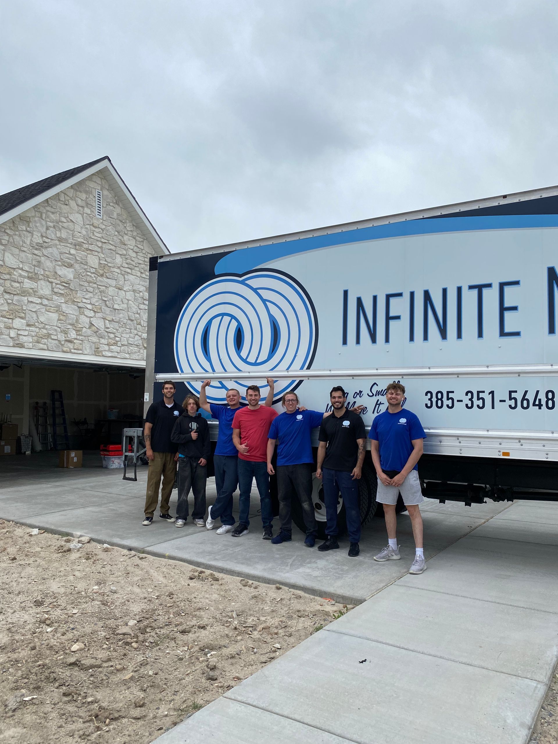 Group of movers by a truck with an 