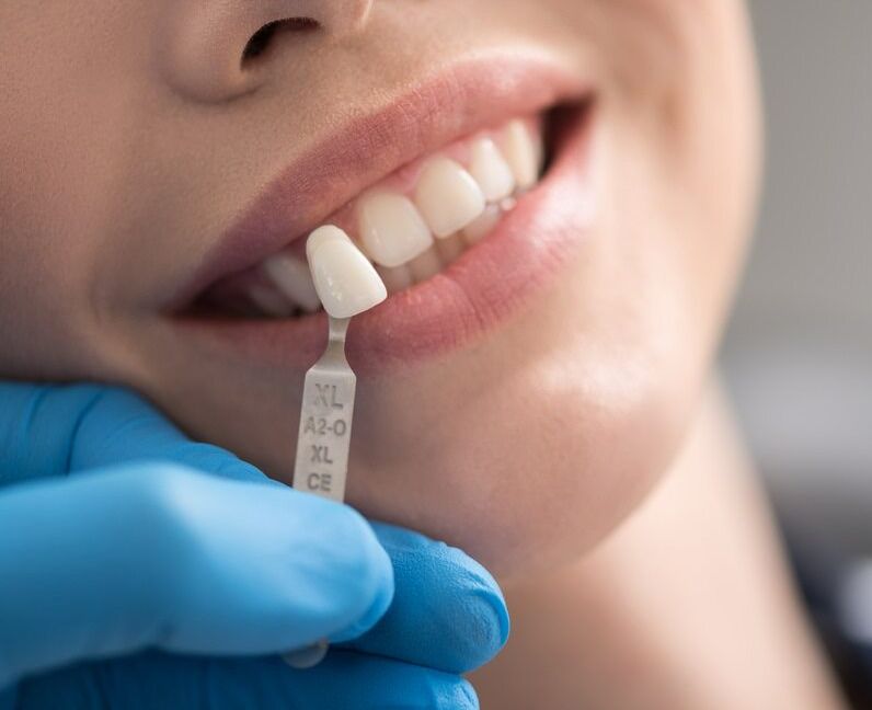 A Woman Is Getting Her Teeth Examined By A Dentist — Mittagong Dental Care In Mittagong, NSW