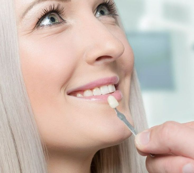 A Woman Is Getting Her Teeth Examined By A Dentist — Mittagong Dental Care In Mittagong, NSW