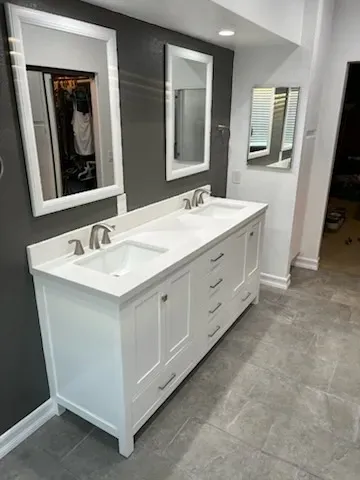 Bathroom vanity upgrade with new countertops by Kearney Restorations
