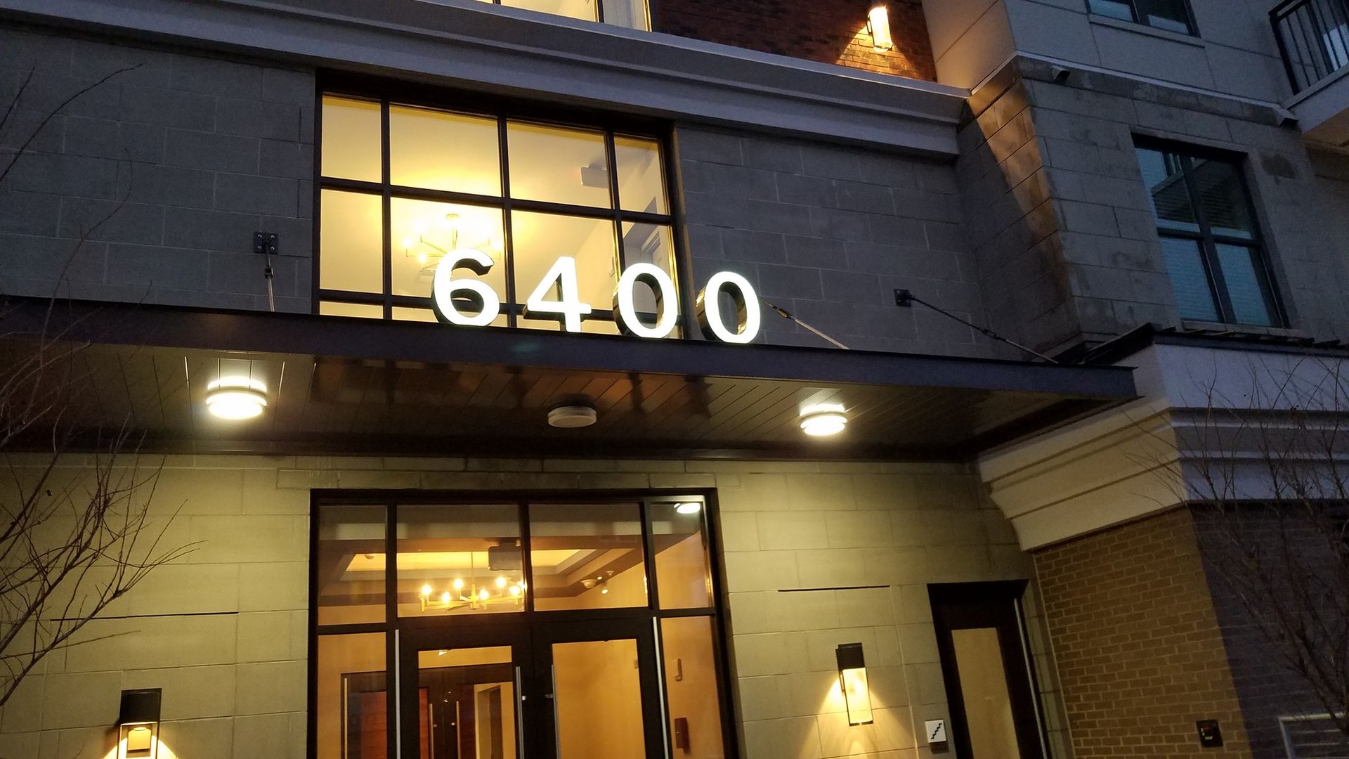 The front of a building with the number 6400 on it